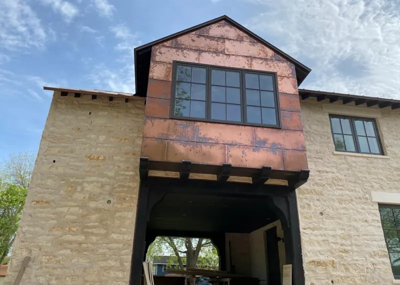 Copper metal panel facade on a stone building for Metal Roof Coating in Broadalbin